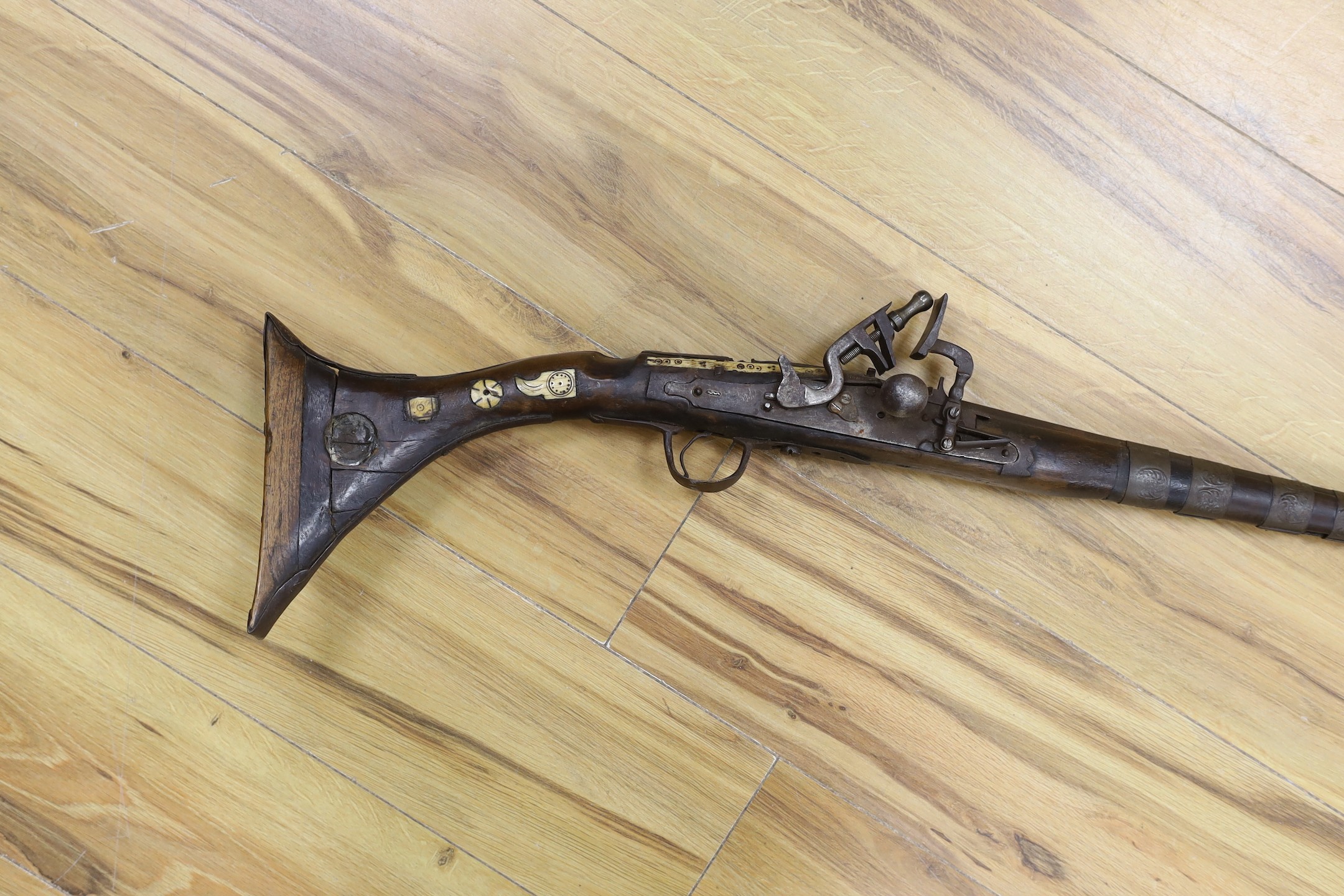 An Eastern antique flintlock rifle - 152cm long